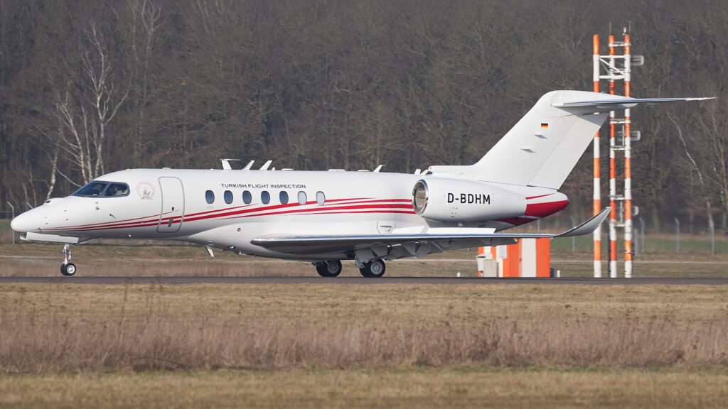White and red Cessna Citation Longitude D-BDHM taxiing at Braunschweig Airport