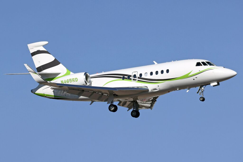Dassault Falcon 2000LXS N465RD climbing out with its landing gear retracting