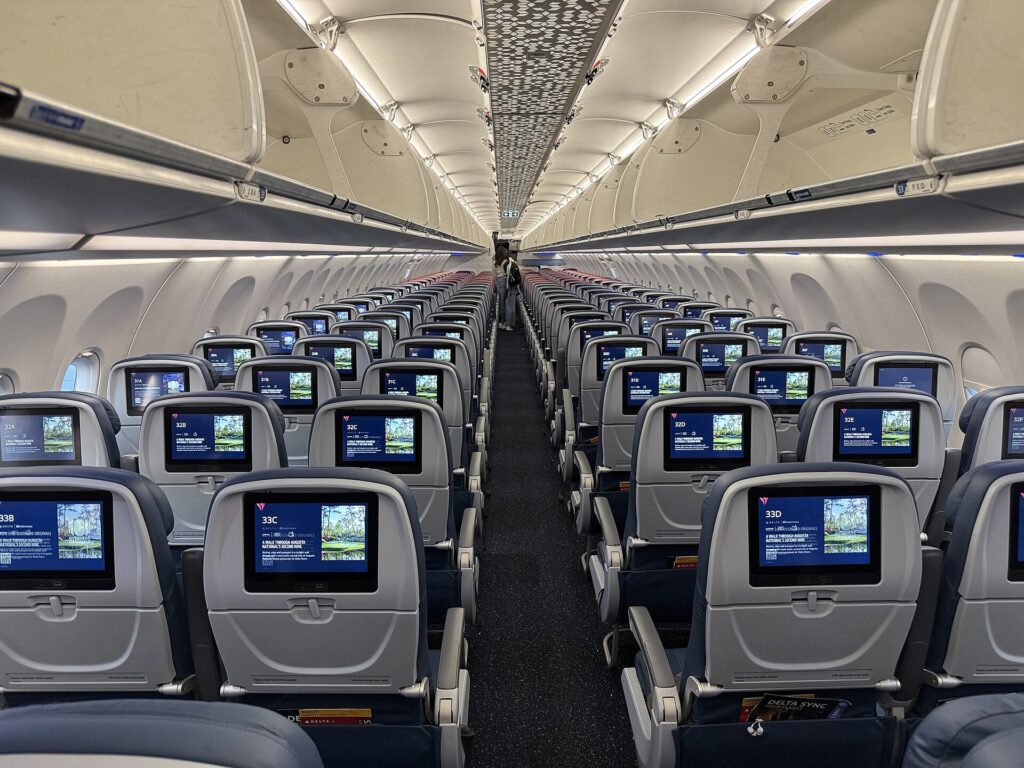 Economy cabin of a Delta Air Lines Airbus A321neo with seatback screens on every seat
