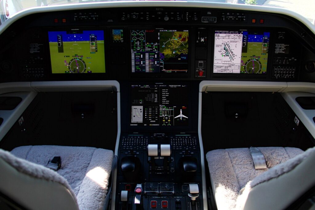 Embraer Legacy 500 cockpit with large Collins displays and side-stick controls