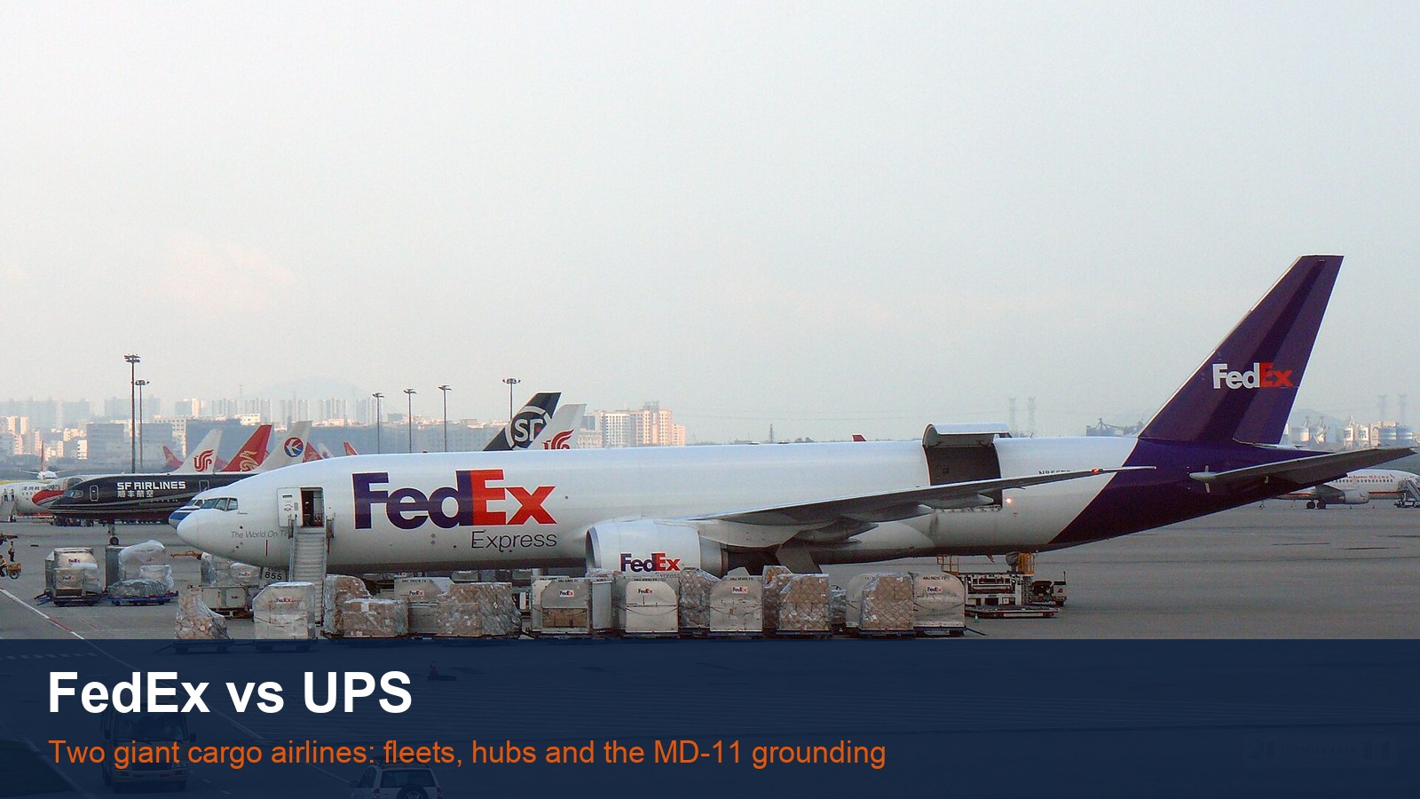 FedEx Boeing 777F freighter being loaded, with the words FedEx vs UPS