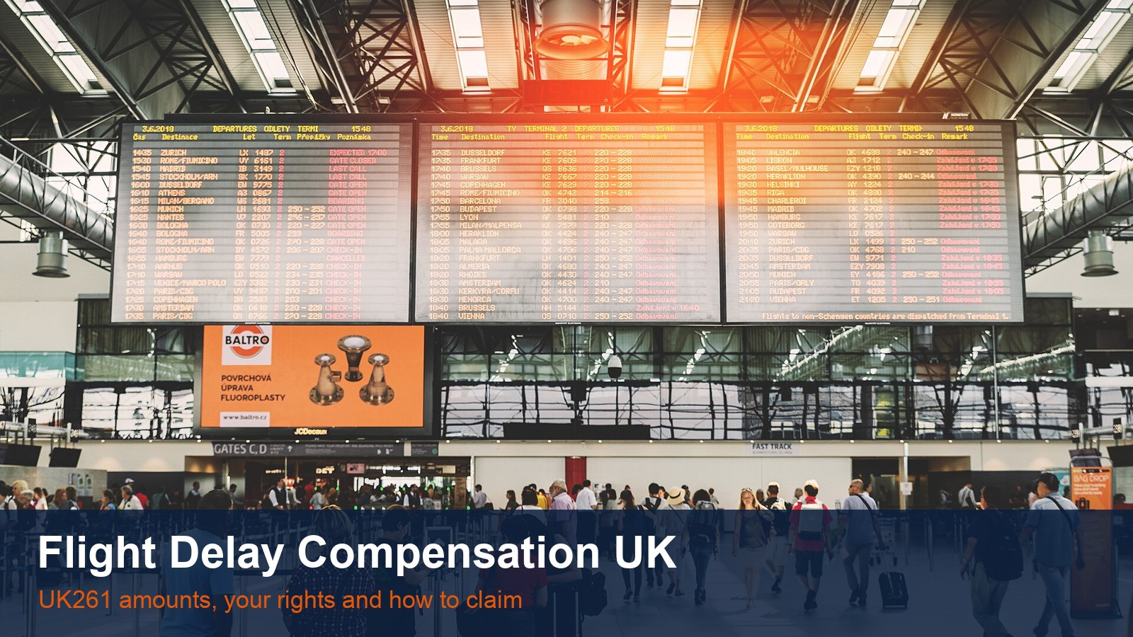 Large flight information boards above a busy airport departure hall, with the words Flight Delay Compensation UK