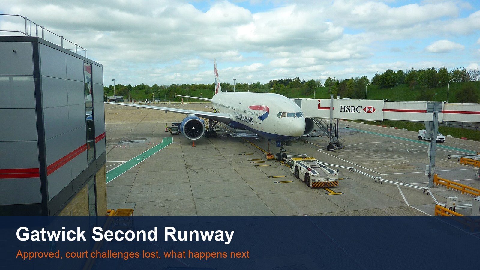 A British Airways Boeing 777-200ER at a gate at London Gatwick Airport, with the words Gatwick Second Runway