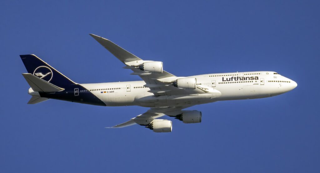 Lufthansa Boeing 747-8 Intercontinental D-ABYF in flight with its four engines and long upper deck