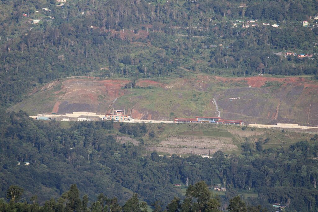 Pakyong Airport in Sikkim, a hilltop runway with mountains in the background