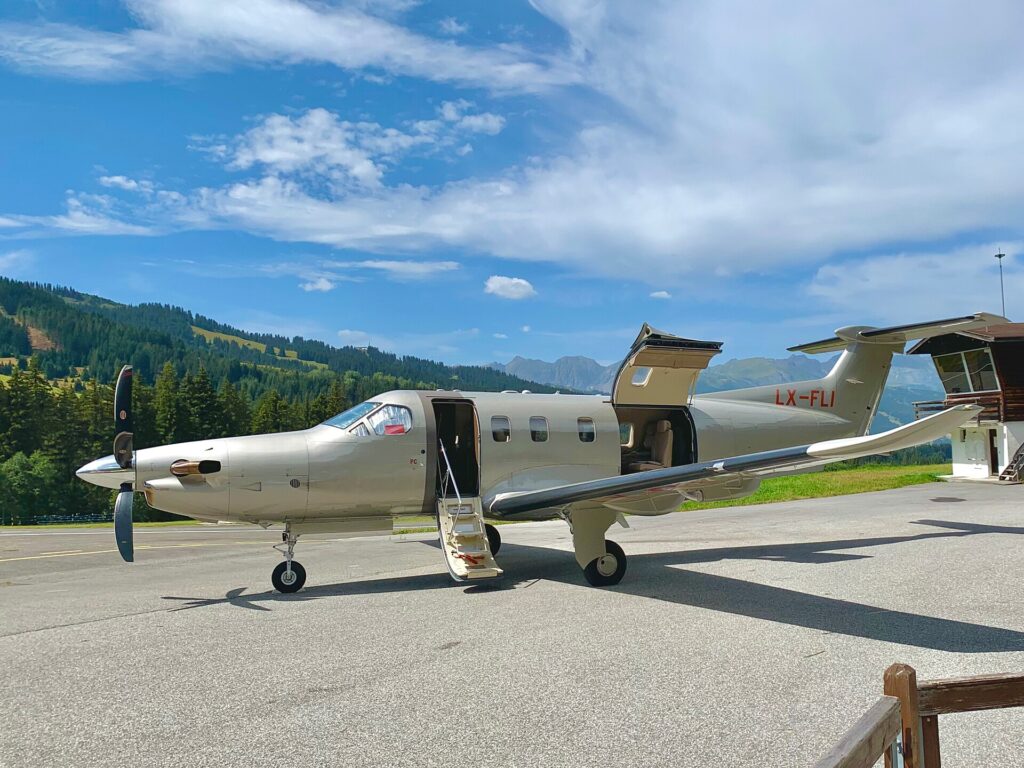 Pilatus PC-12 NGX parked at the Megeve altiport in the French Alps with its cargo door open