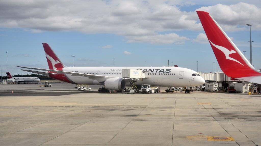 Qantas Boeing 787-9 parked at a gate at Perth Airport