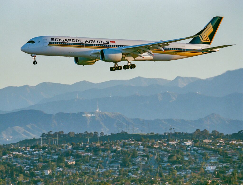Singapore Airlines Airbus A350-900ULR on approach with hills behind