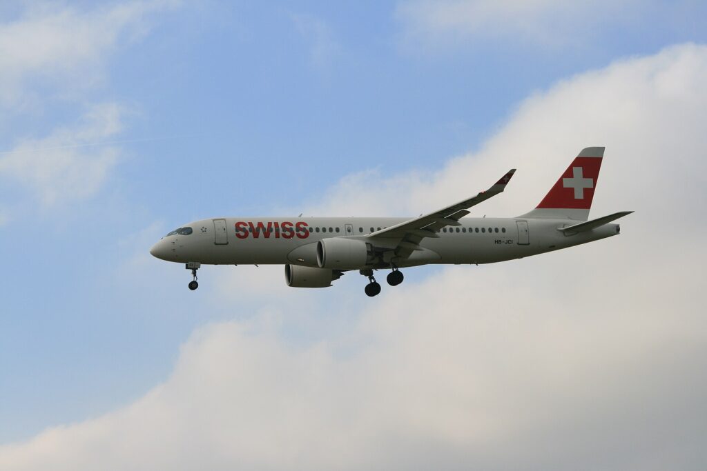 SWISS Airbus A220-300 registration HB-JCI on approach with landing gear down
