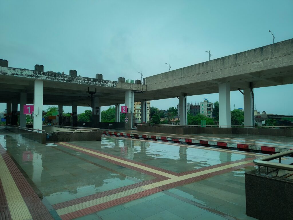 Platform of Targhar railway station in Navi Mumbai on a rainy day